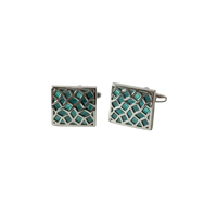Pair of square cufflinks with green lattice design on a light gray background