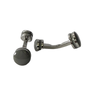 A pair of silver-toned metal belly button rings with dark gray circular cufflink